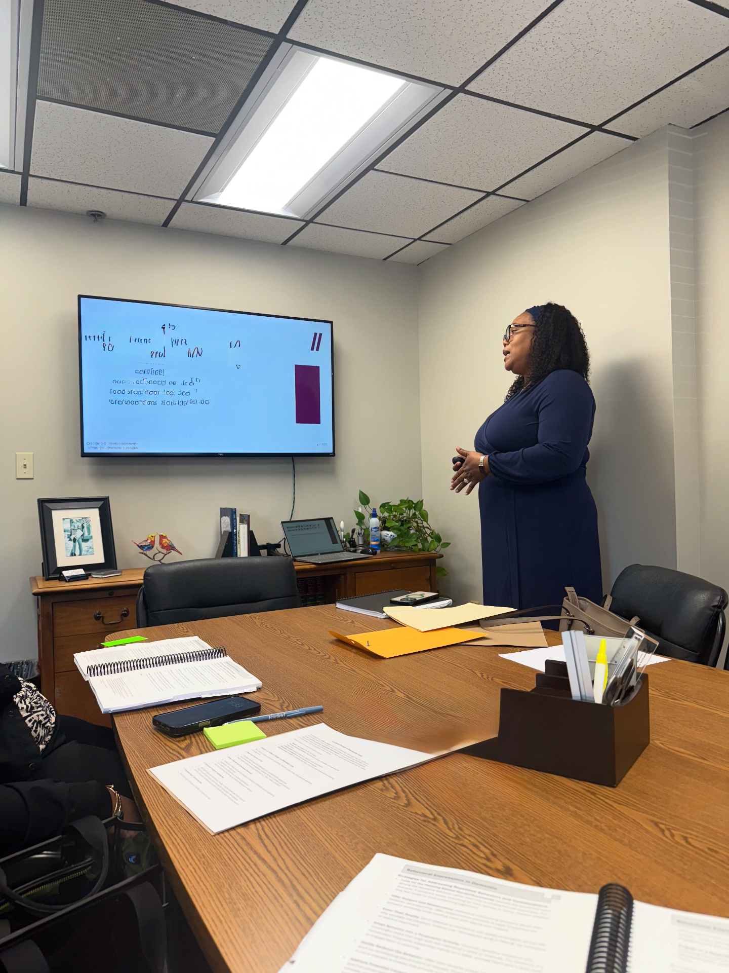 Gayon Buchanan leading a dementia care training session with a professional care team
